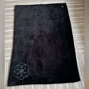 Apple Inc. branded plush black fleece blanket, *meditation ring icon*
